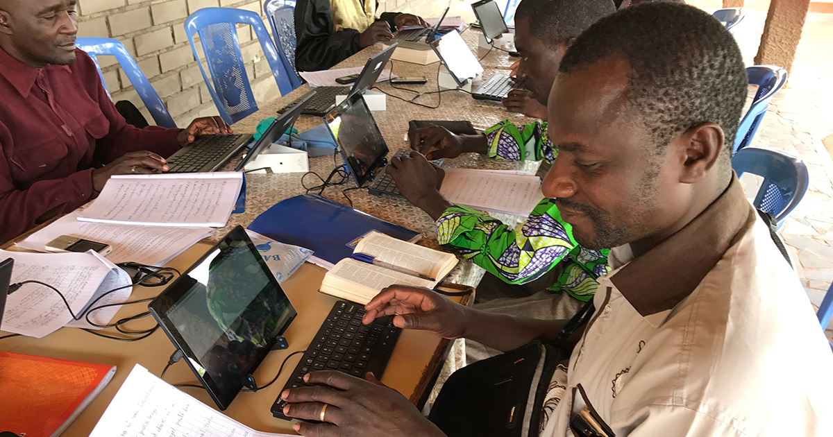 National Bible Translators with Computer Tablets National Bible Translators with Computer Tablets