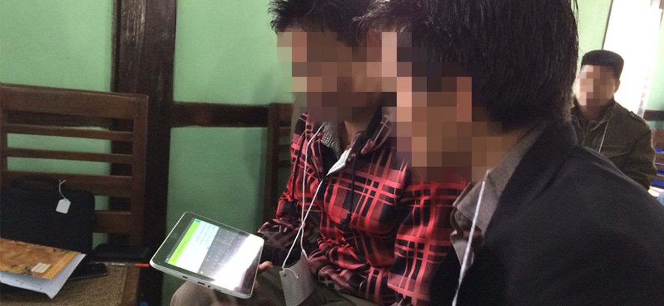 Bible translators using tablet Bible translators using tablet
