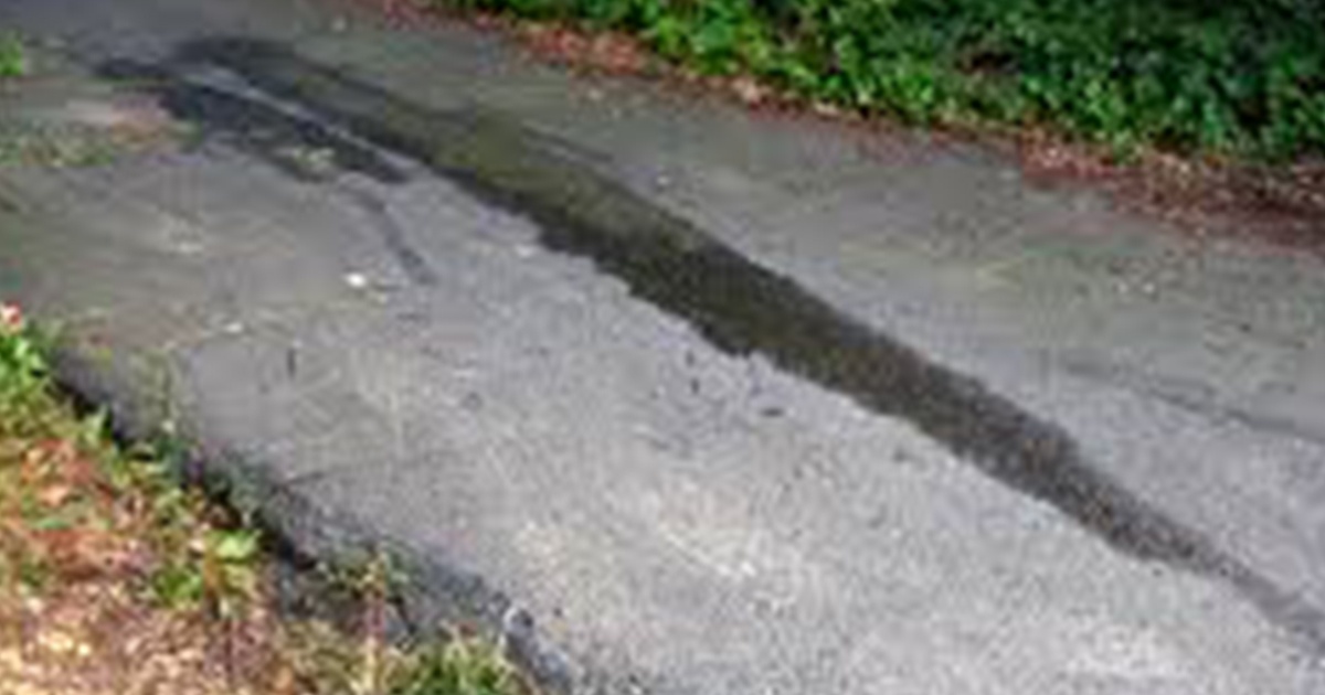 Photo of driveway with oil stains Photo of driveway with oil stains